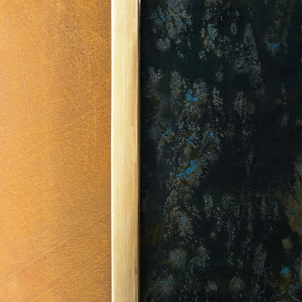 Pooky - Kite Wall Mounted Candle Holder - Antiqued Brass displayed on textured surfaces.