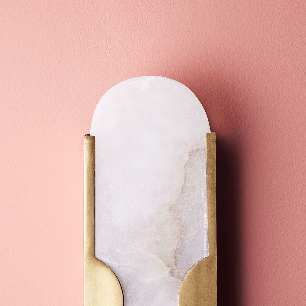 Pooky - Epicurus Alabaster Wall Light showcasing alabaster and brass design against a pink wall.