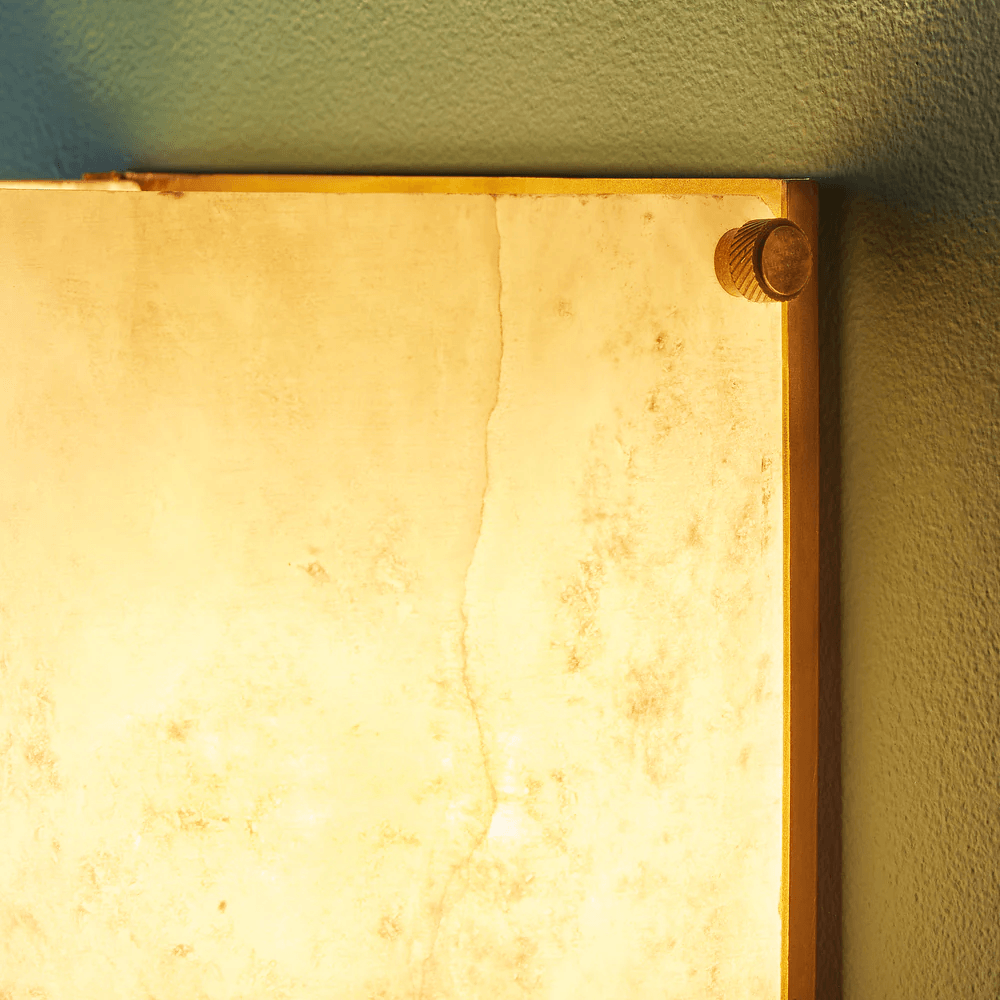 Pooky - Zeno Alabaster Wall Light showcasing unique alabaster design and warm glow.