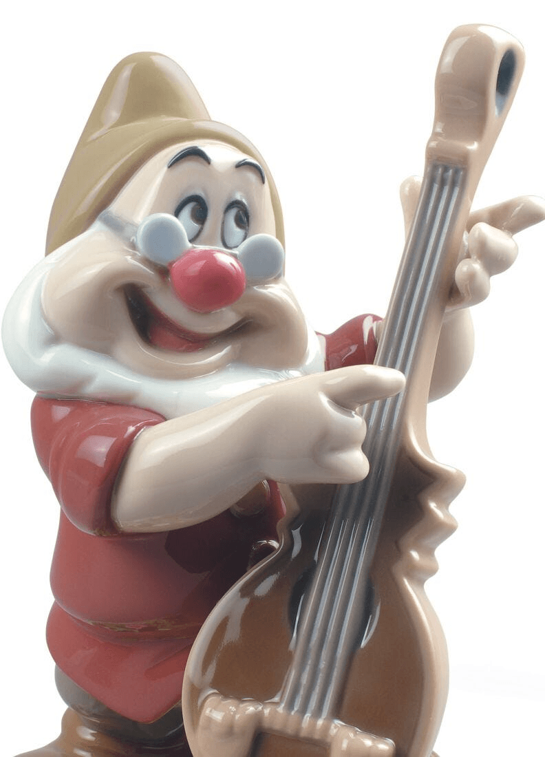 Lladró - Doc Snow White Dwarf Figurine holding a musical instrument, crafted in fine porcelain.