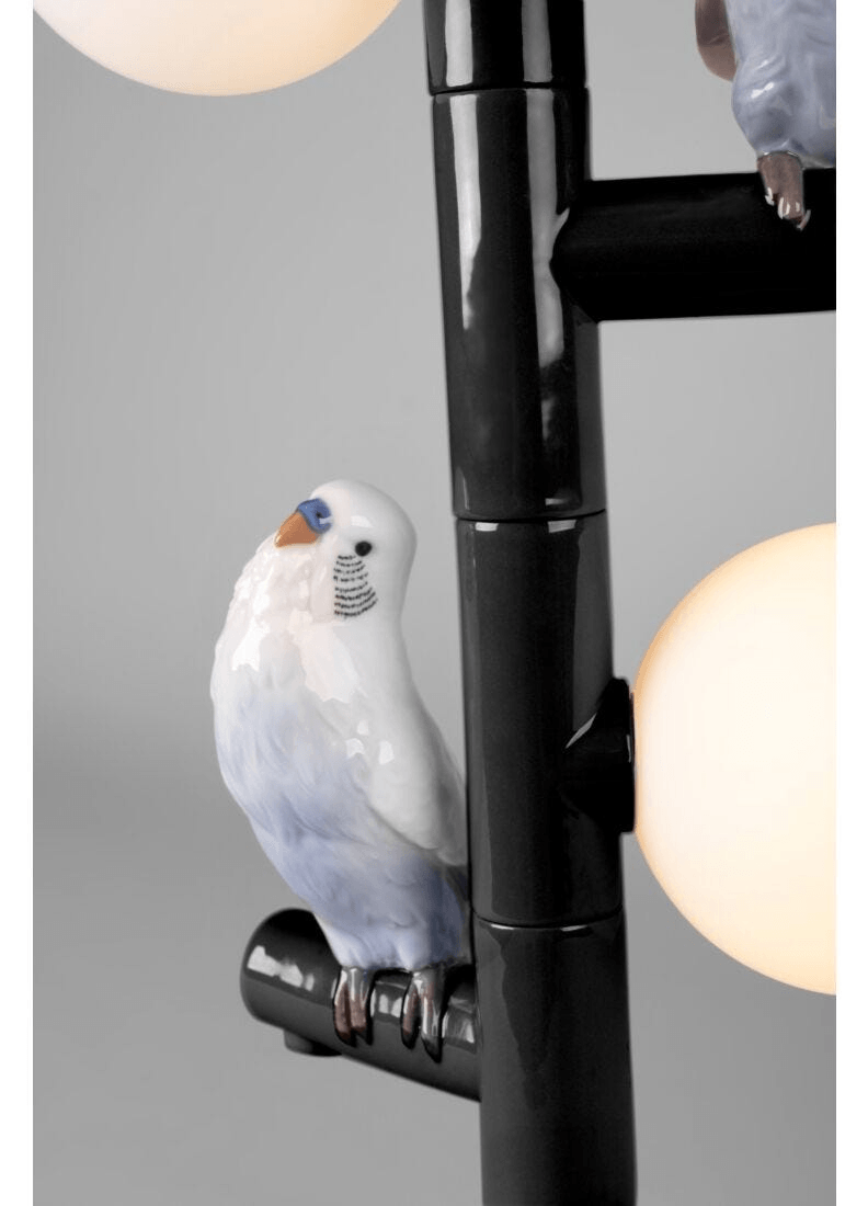 Lladró - Parrot Table Lamp - Black featuring a close-up of a detailed porcelain bird perched on the lamp.