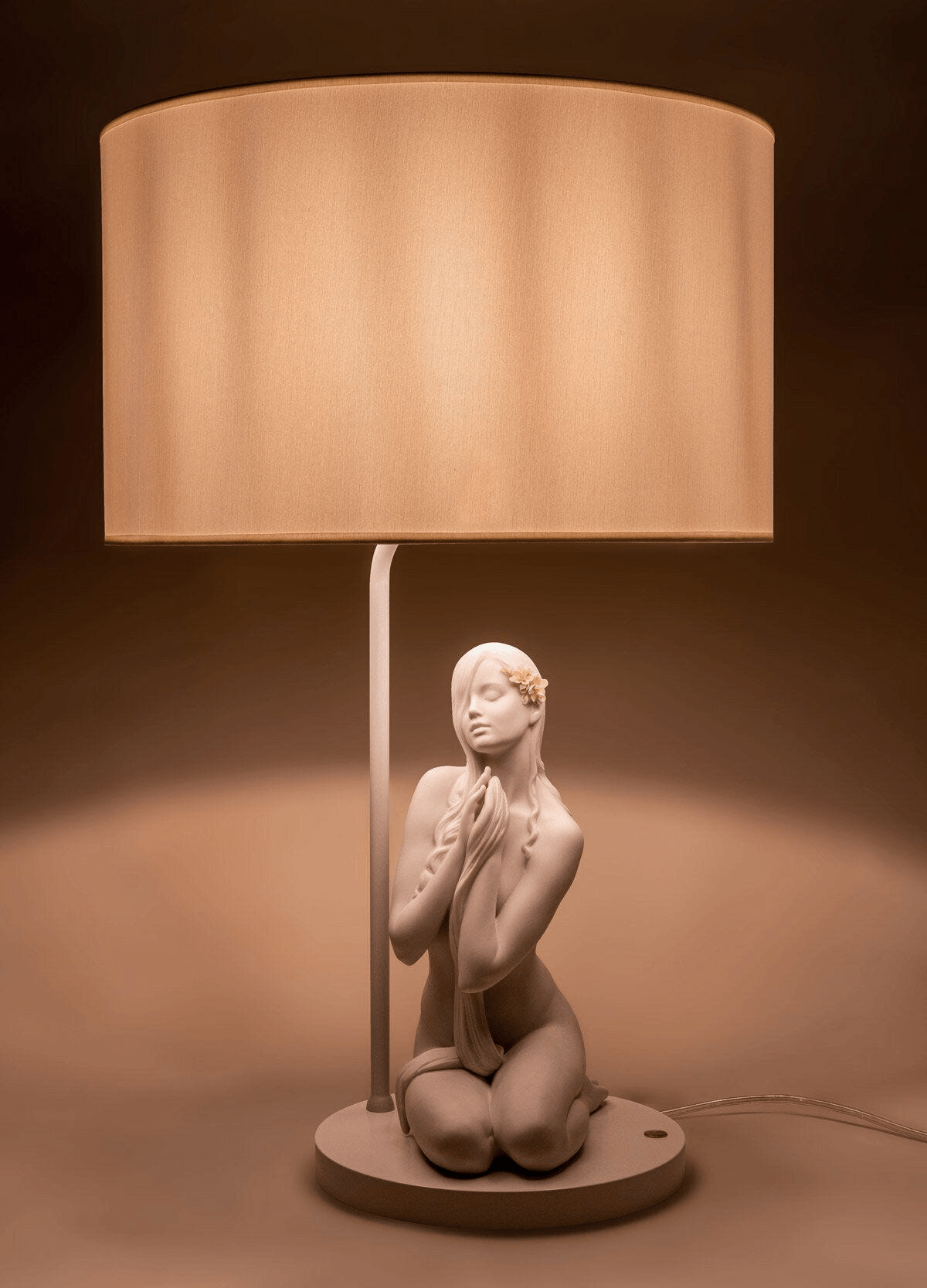 Lladró - Inner Peace Table lamp featuring a Lladro matte white Porcelain kneeling figure. Beautiful tabletop lamp with fabric shade.