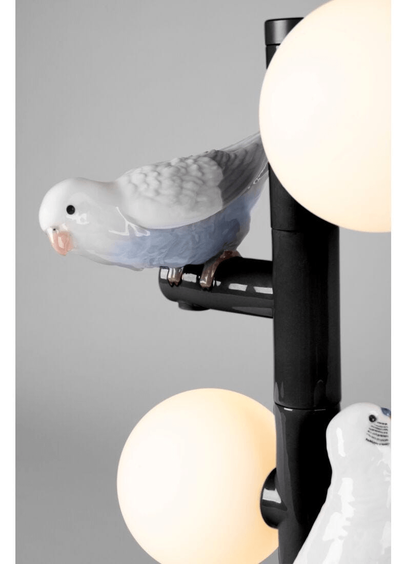 Lladró - Parrot Table Lamp - Black with porcelain bird details and glowing spheres.