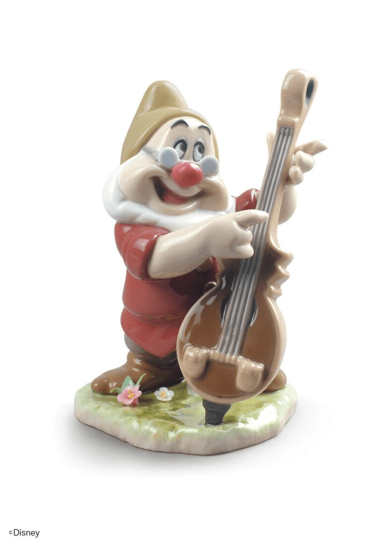 Lladró - Doc Snow White Dwarf Figurine depicting a cheerful dwarf with a string instrument in glossy porcelain.