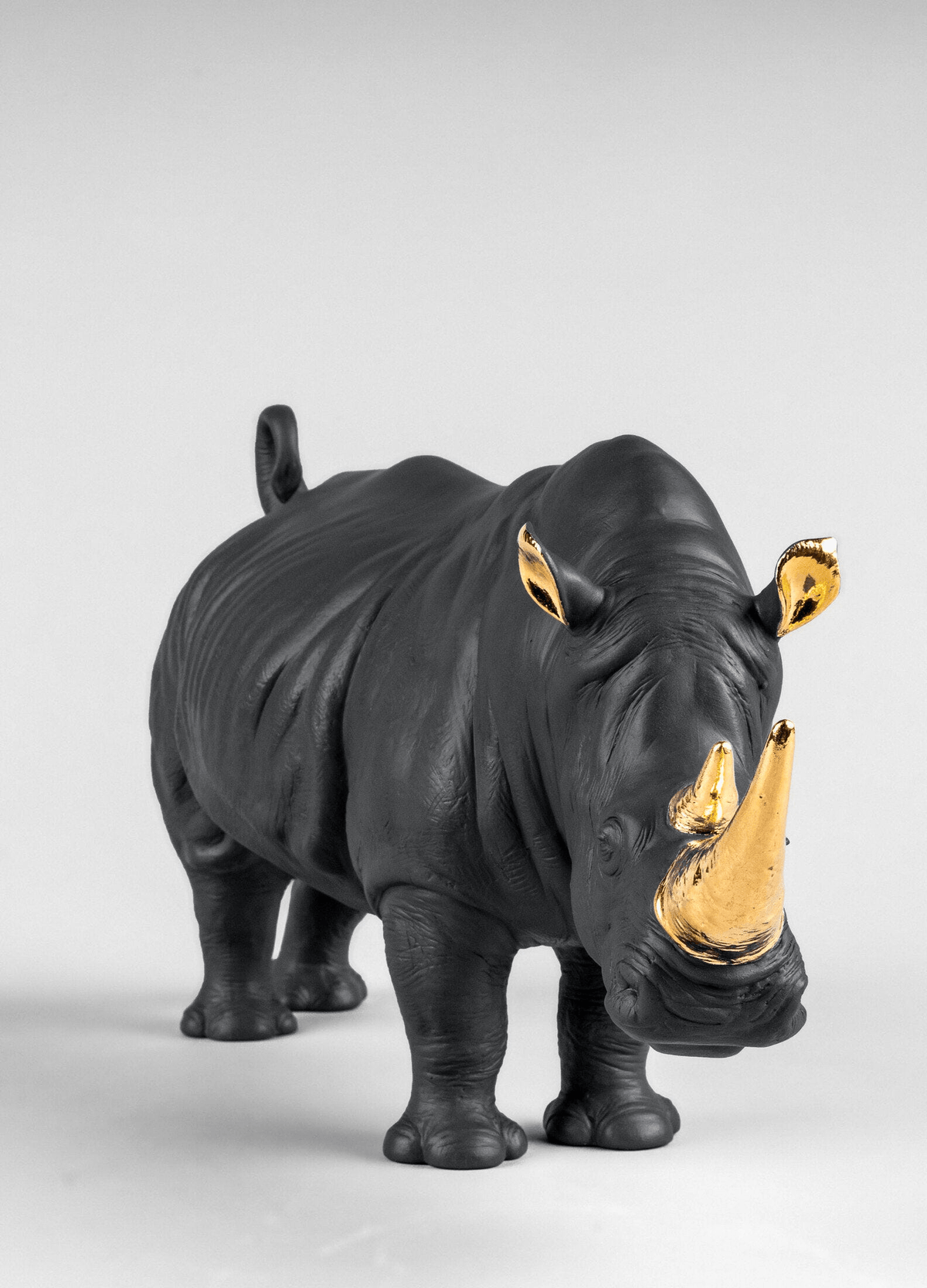 Lladró - Rhino Sculpture - Black-gold - Limited Edition in matte black porcelain with golden luster details.