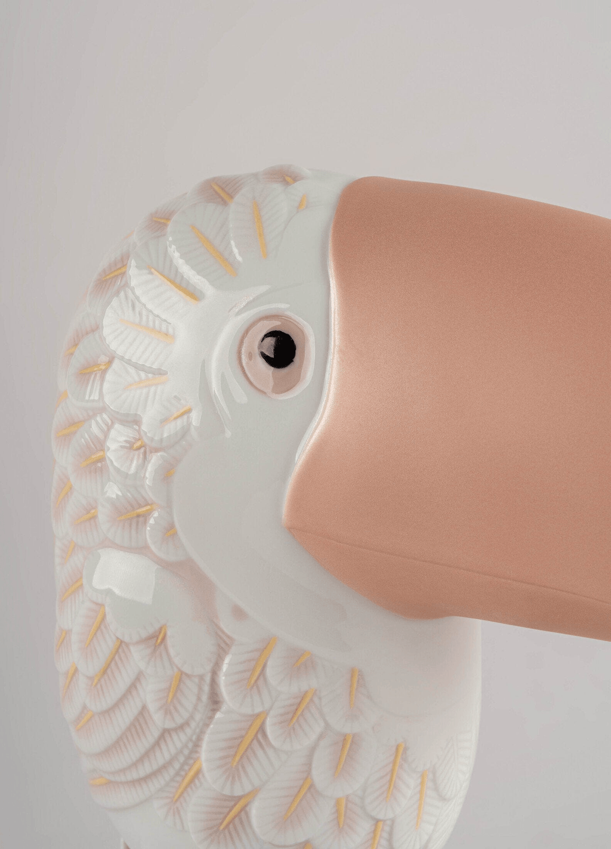 Lladró - Face 2 Face - Toucan, detailed porcelain bird with etched feathers and a smooth beak.
