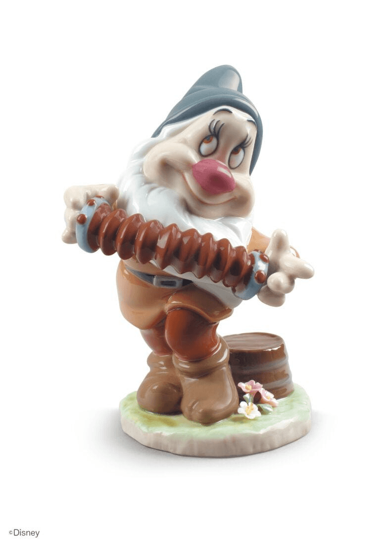 Lladró - Bashful Snow White Dwarf Figurine, a charming porcelain sculpture of Bashful holding an accordion.