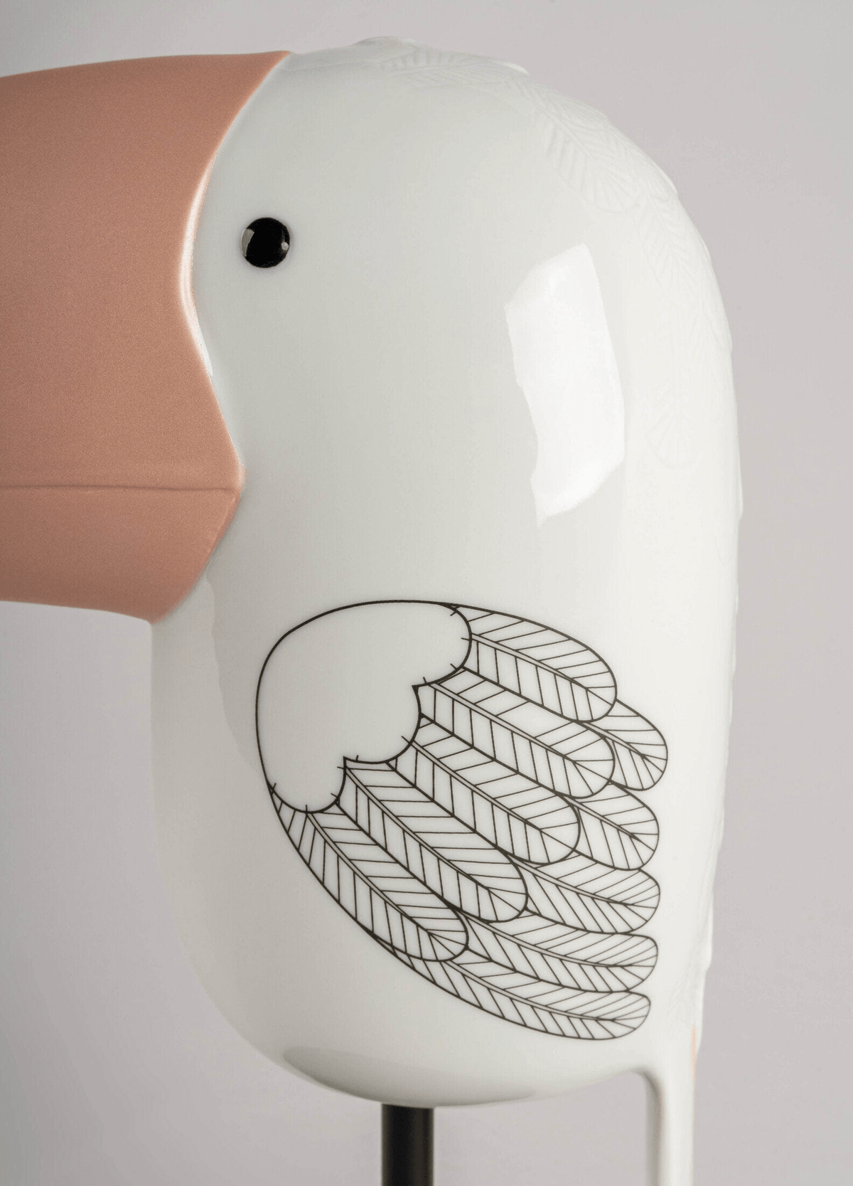 Lladró - Face 2 Face - Toucan close-up showcasing porcelain craftsmanship and intricate feather designs.