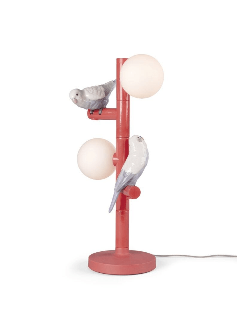 Lladró - Parrot Table Lamp - Red featuring intricately designed porcelain birds and glowing orbs, ideal for stylish interiors.
