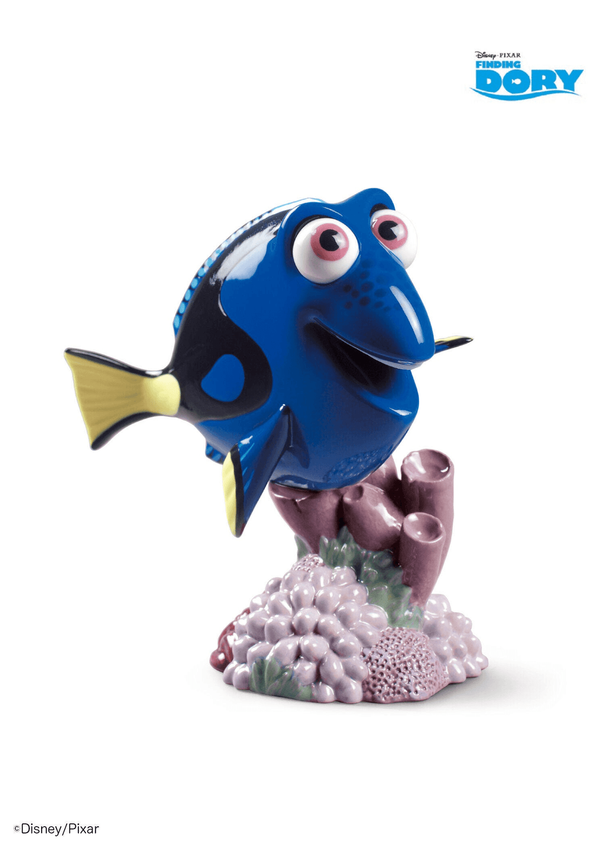Lladró - Dory Figurine made of porcelain, featuring a smiling blue fish character on a coral base.