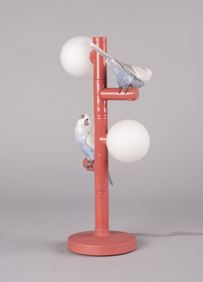Lladró - Parrot Table Lamp - Red showcasing porcelain parrots and glossy coral finish for stylish interiors.