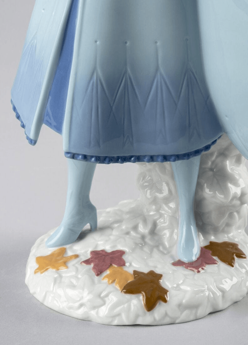 Lladró - Elsa Figurine showing porcelain details and colorful leaves on the base, handcrafted in Spain.