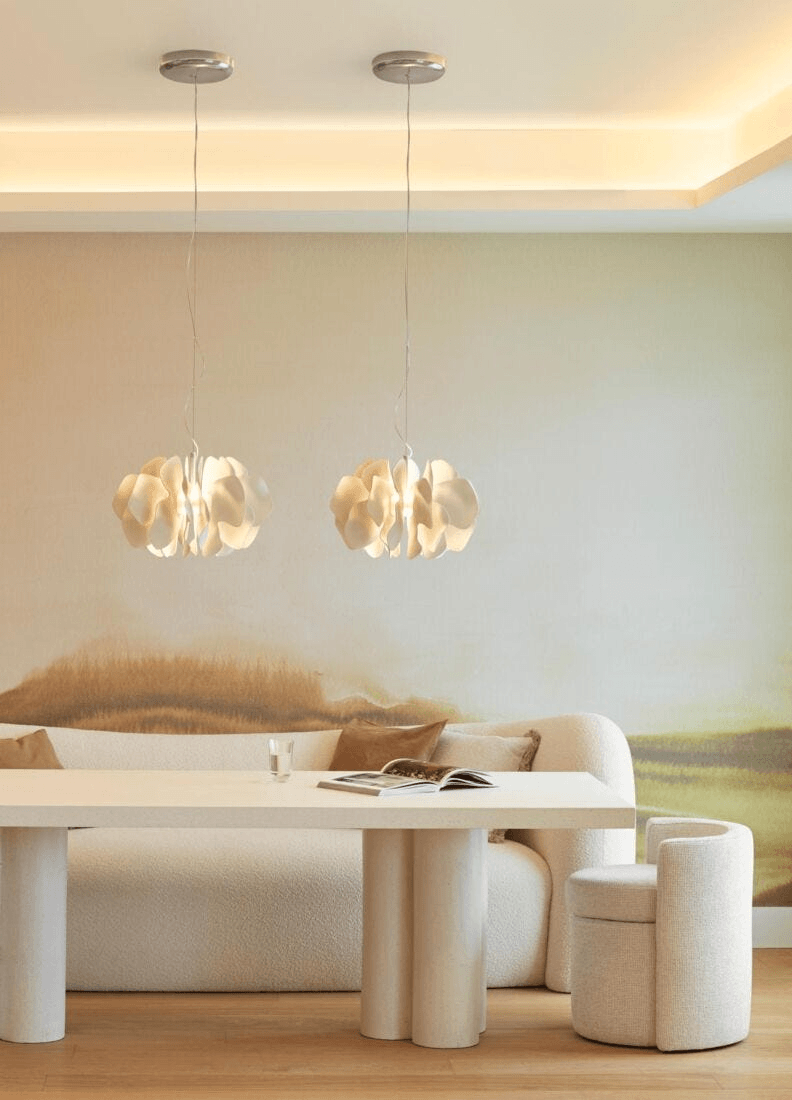 Lladró - Nightbloom Pendant Light - N40 - White illuminating a stylish dining area with modern decor.