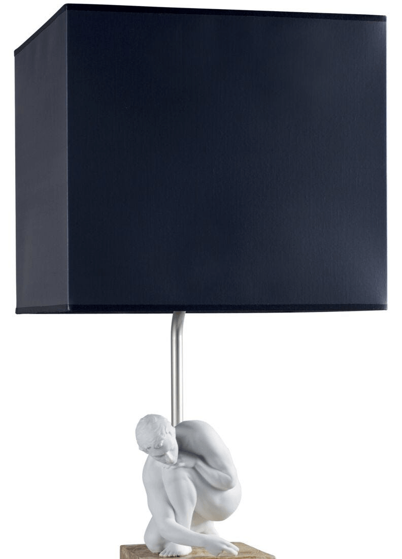 Lladró - Scientia Table Lamp featuring porcelain base and navy shade, combining art and functionality.