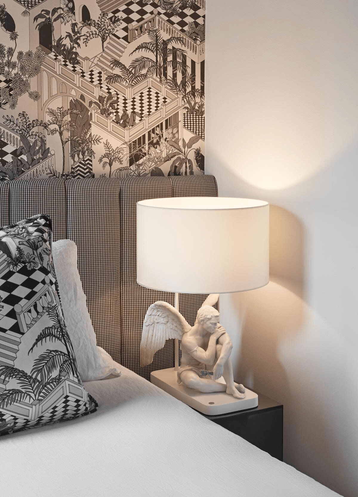 Lladró - Protective Angel Table Lamp in white Porcelain by Lladro on a bedside table.