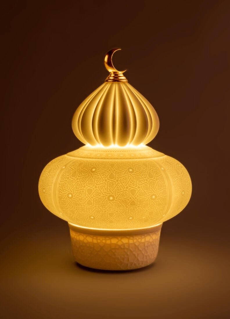 Lladró - Majestic Nights Wireless Lamp in porcelain with latticework design, emitting a warm glow.