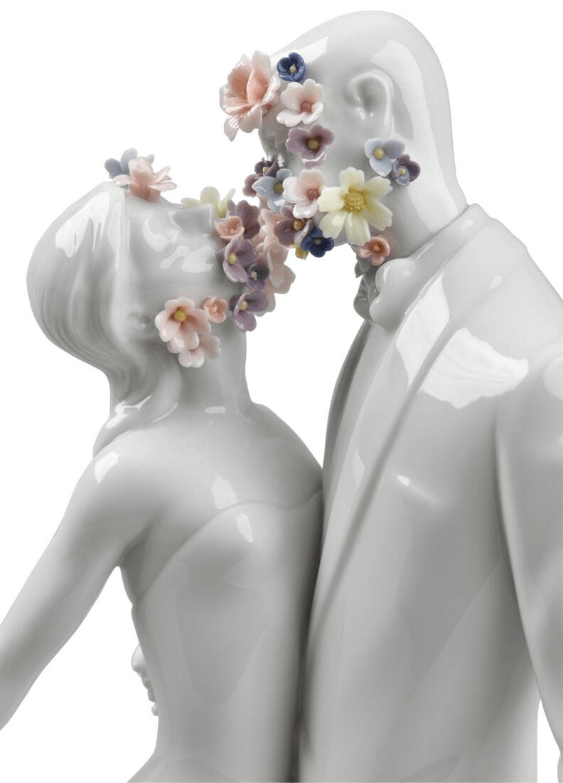 Lladró - Love I (Blossoms) - Sculpture featuring a couple adorned with colorful porcelain flowers.