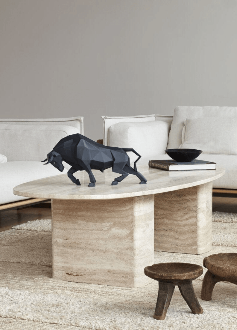 Lladró - Bull Sculpture - Black matte displayed on a modern coffee table in a stylish living room.