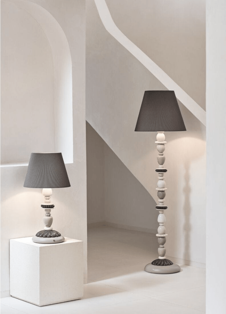 Lladro Porcelain lighting: Lladró - Firefly Floor Lamp - Pearly with a grey cloth shade in a white room.