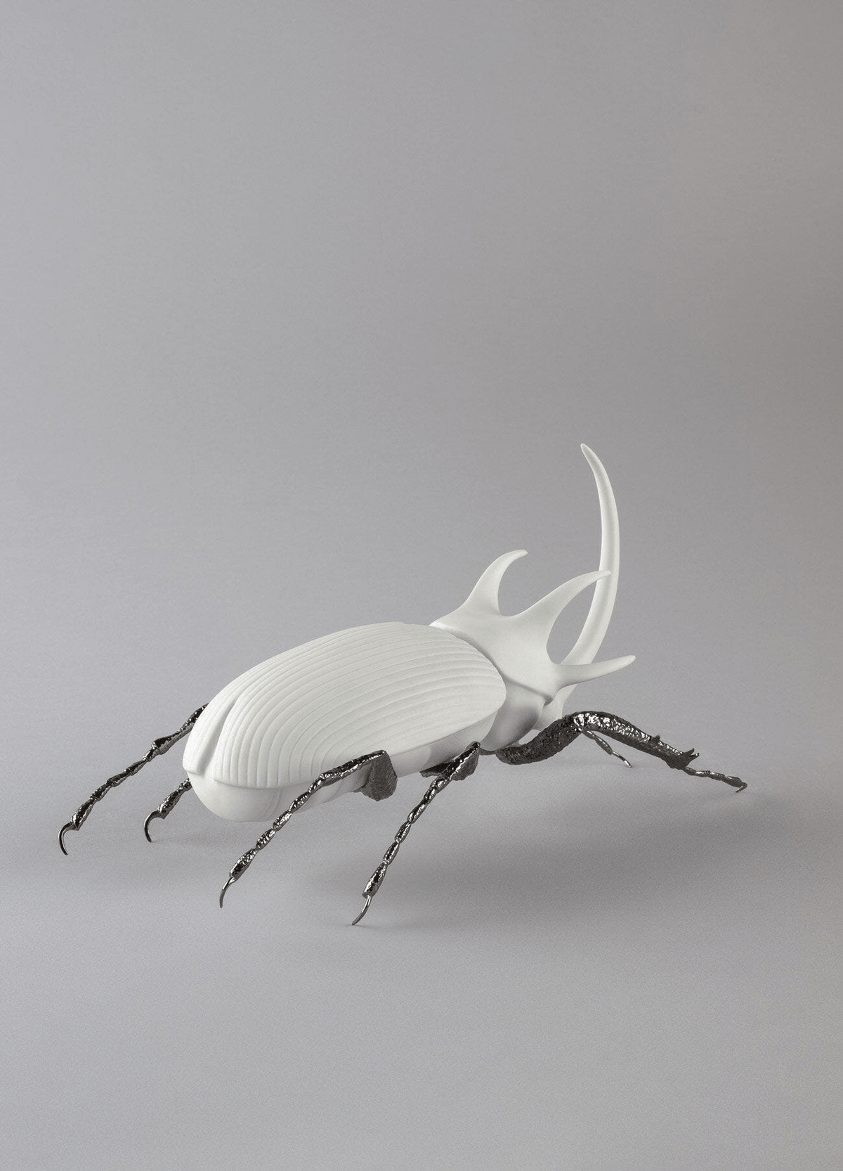 Lladró - Rhinoceros Beetle Figurine - Matte White handcrafted porcelain with brass legs, perfect for decor or gifts.