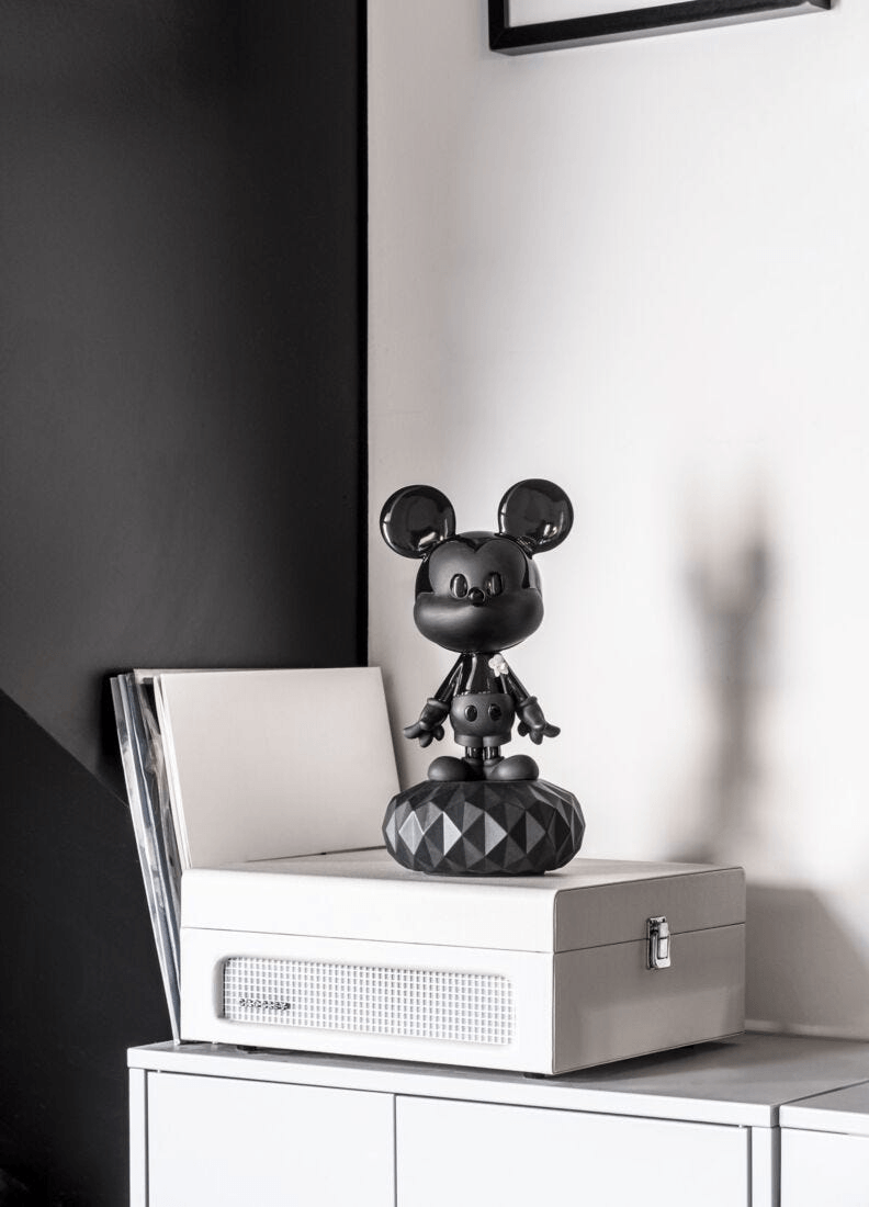 Lladró - Mickey Total Black Sculpture displayed on furniture with a minimalist design in a stylish interior.