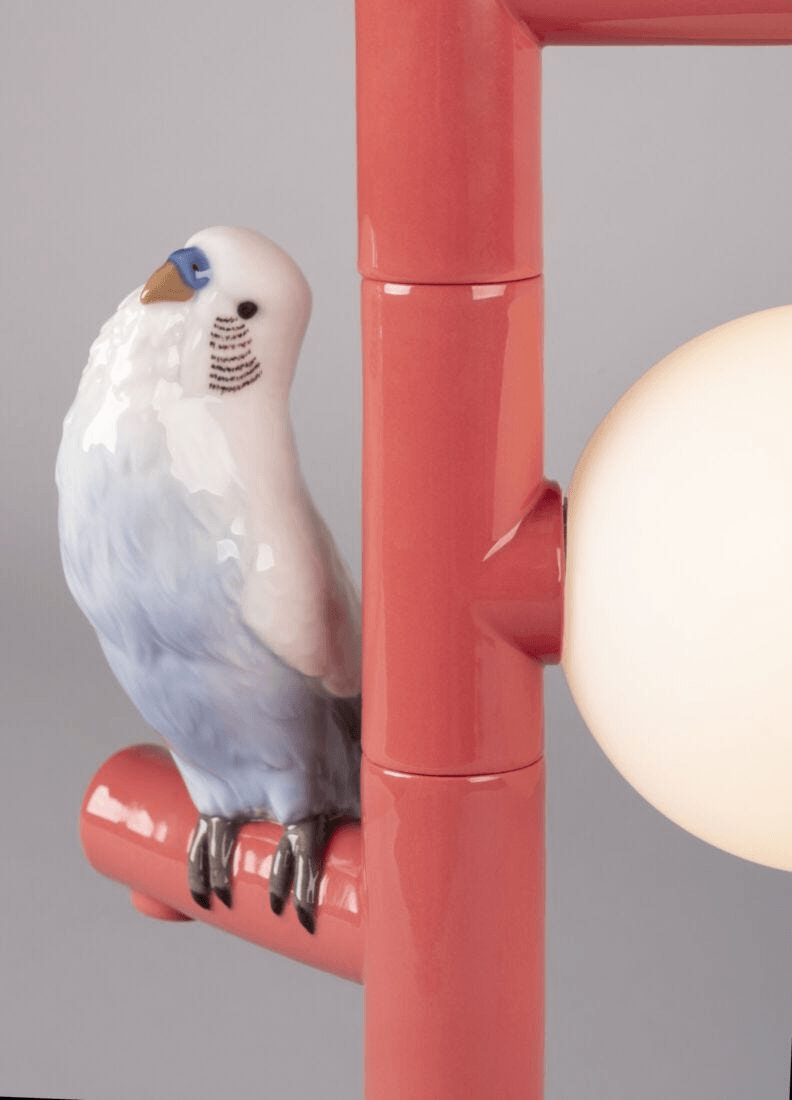 Lladró - Parrot Table Lamp - Red showcasing intricate porcelain bird detail in coral accents.
