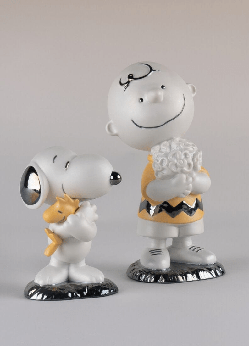 Lladró - Charlie Brown™ Figurine featuring Charlie Brown and Snoopy in detailed porcelain craftsmanship.