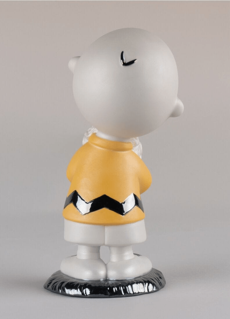 Lladró - Charlie Brown™ Figurine made of porcelain, displaying Charlie Brown's iconic design in matte and glazed finish.