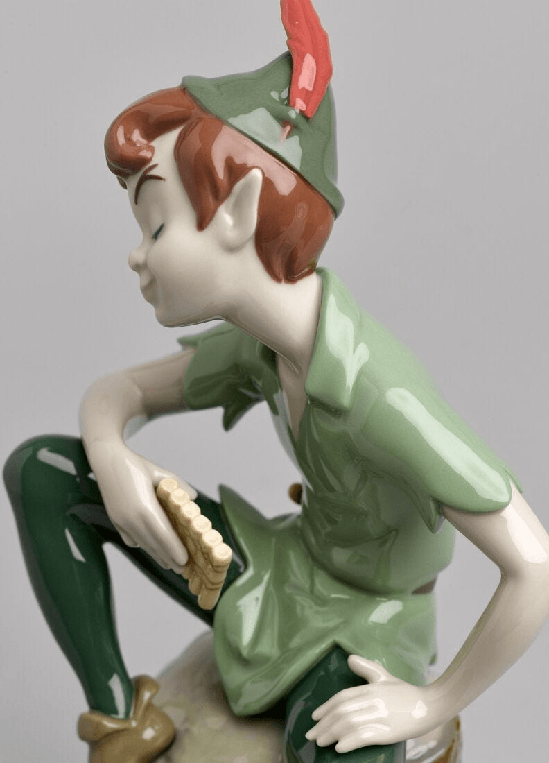 Lladró - Peter Pan Figure in glazed porcelain, showcasing signature colors and detail, perfect for collectors.