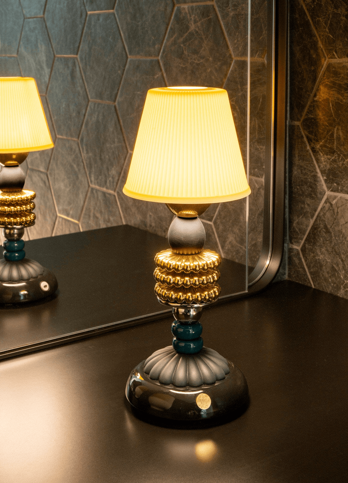 Porcelain Lladro: Lladró - Firefly cordless lamp by Olga Hanono with metallic and black base.