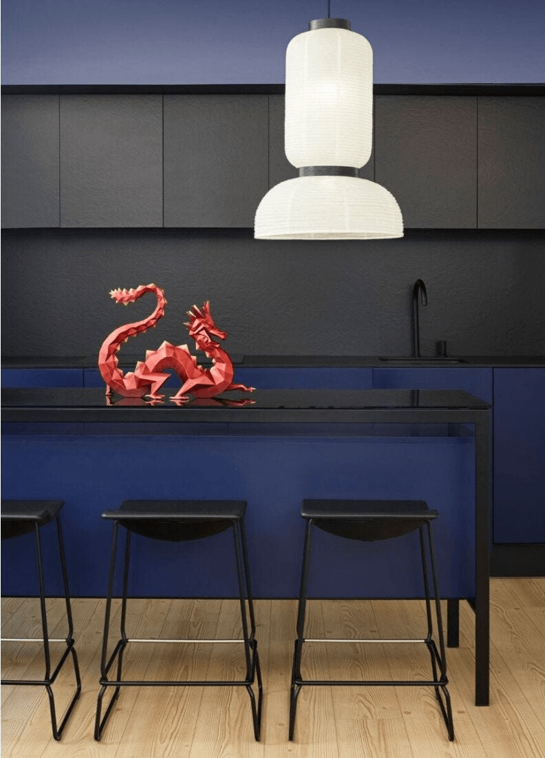 Lladró - Dragon Sculpture - Limited Edition displayed on a black kitchen countertop under modern lighting.