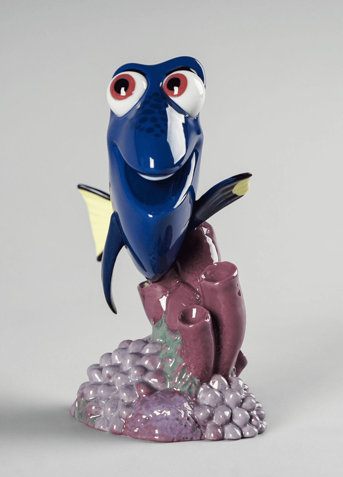 Lladró - Dory Figurine made of porcelain, featuring a vibrant blue design and playful expression, handcrafted in Spain.