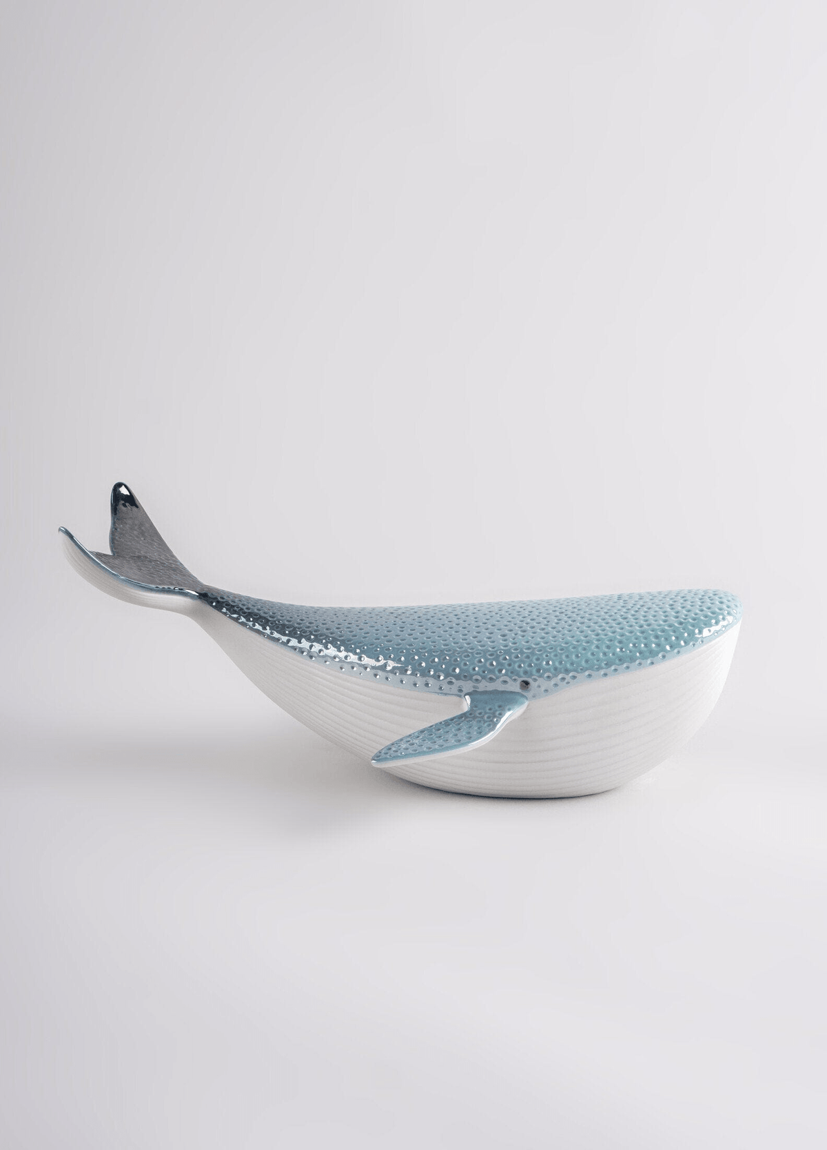 Lladró - Little Whale porcelain decorative piece with glossy white and blue finish, showcasing a modern whale design.