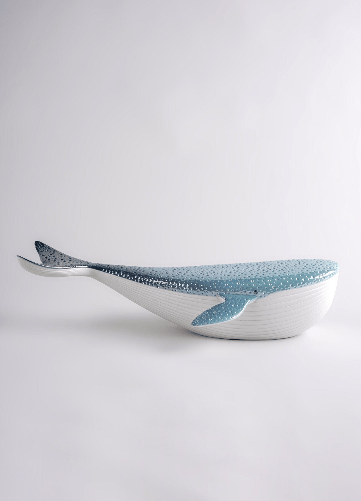 Lladró - Whale porcelain decorative piece in white and blue, showcasing a contemporary whale design.