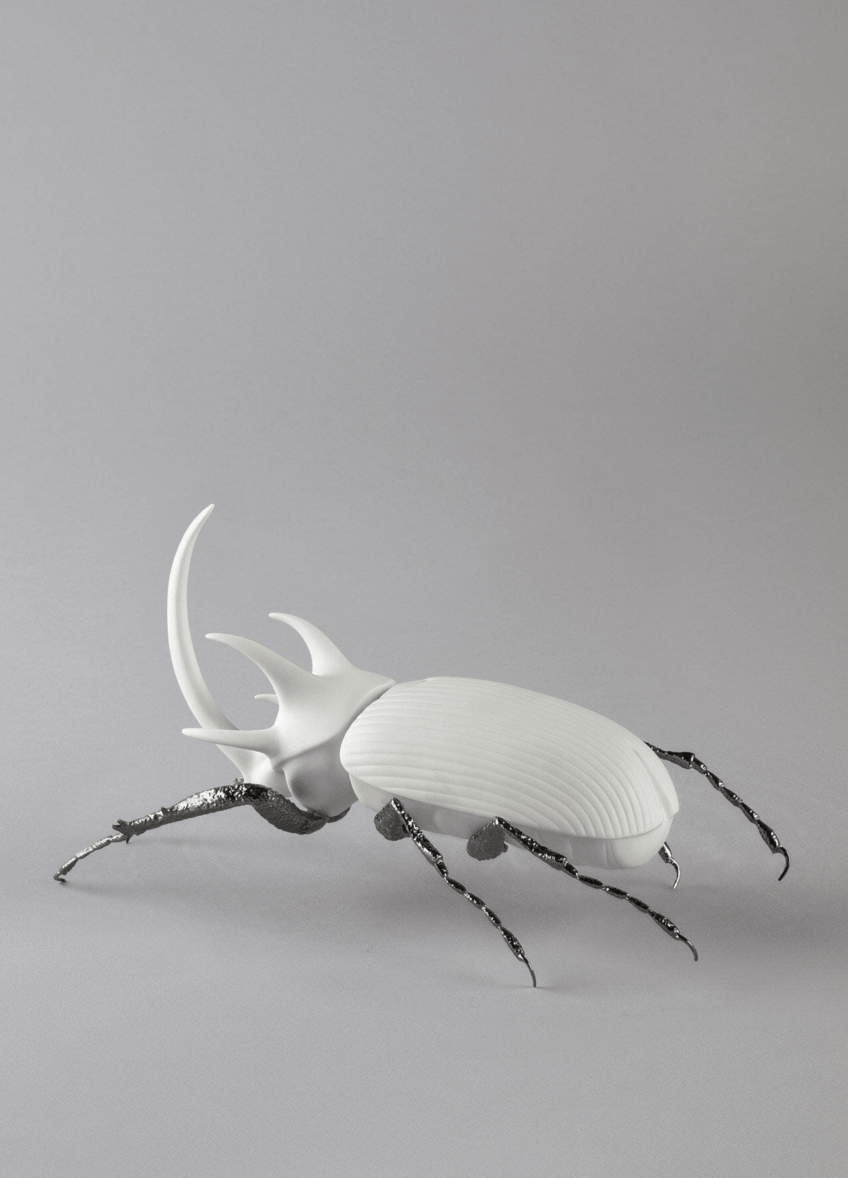 Lladró - Rhinoceros Beetle Figurine - Matte White in porcelain with brass legs, perfect for nature lovers and collectors.