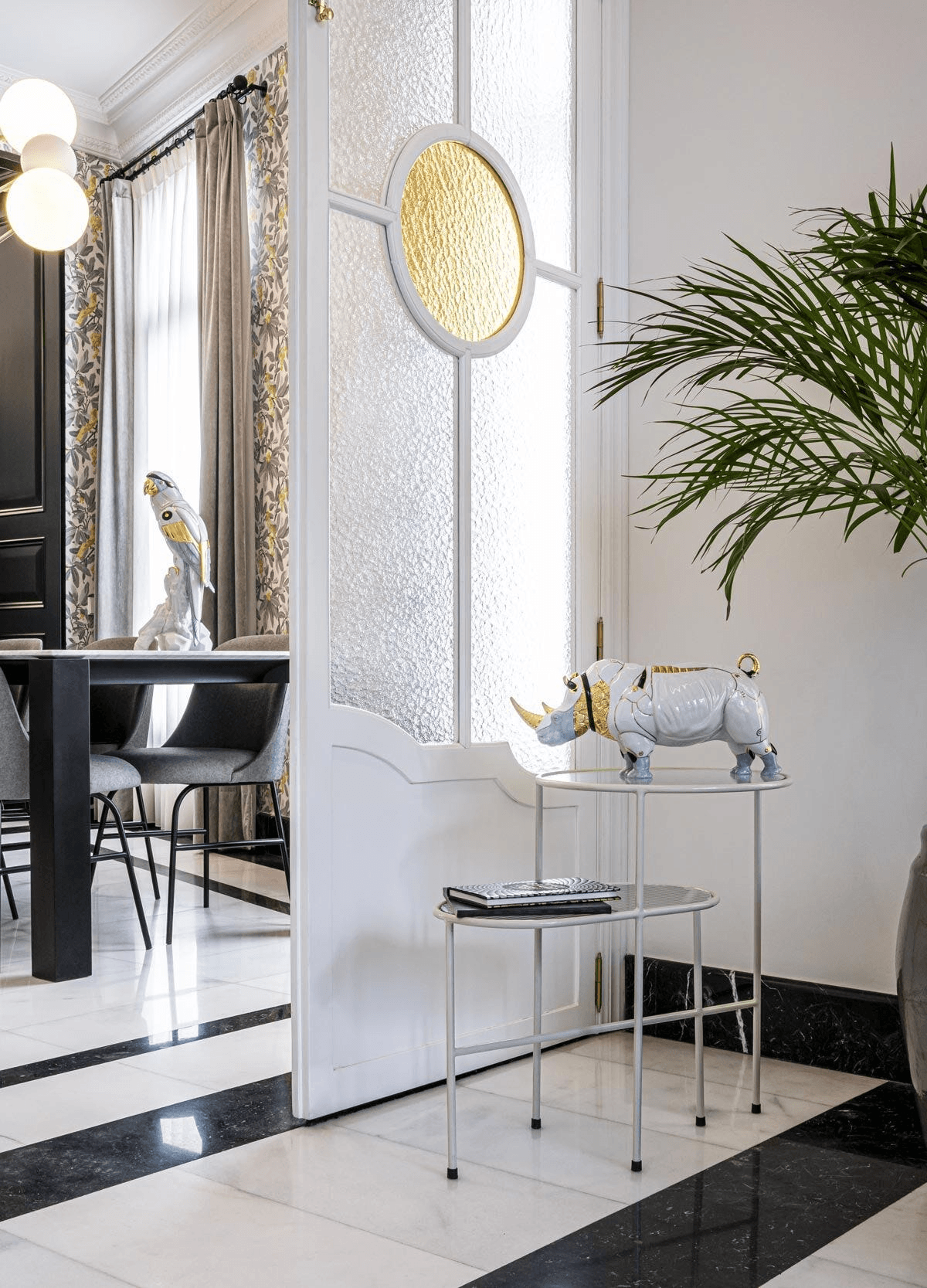 Lladró - Rhino Cyborg Sculpture displayed on a stylish table in a modern interior setting.