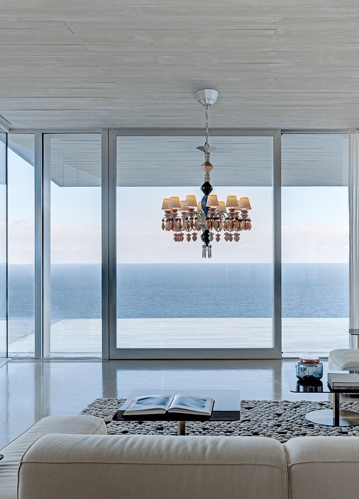 Lladró - Belle de Nuit 12 Lights Chandelier - Multicolor beautifully illuminating a modern living space.