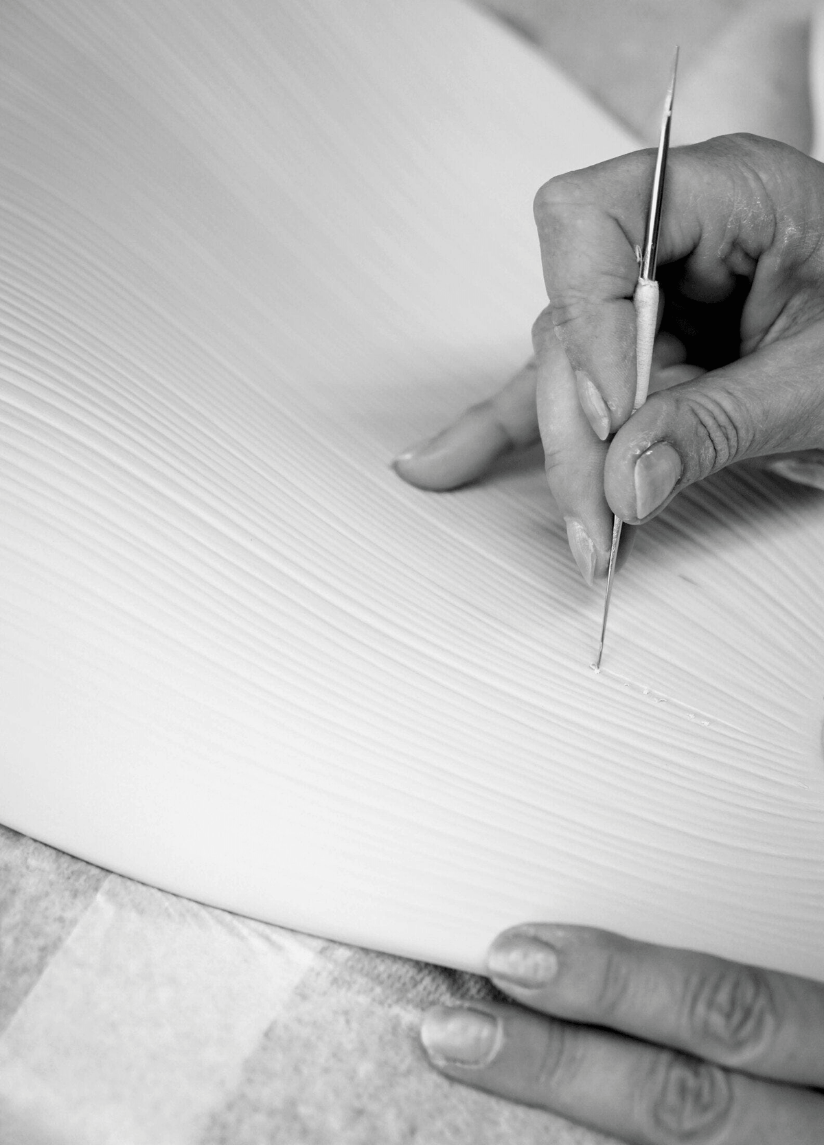 Craftsmanship process of Lladró - Nightbloom Wall Sconce - Golden luster, showcasing porcelain detailing.