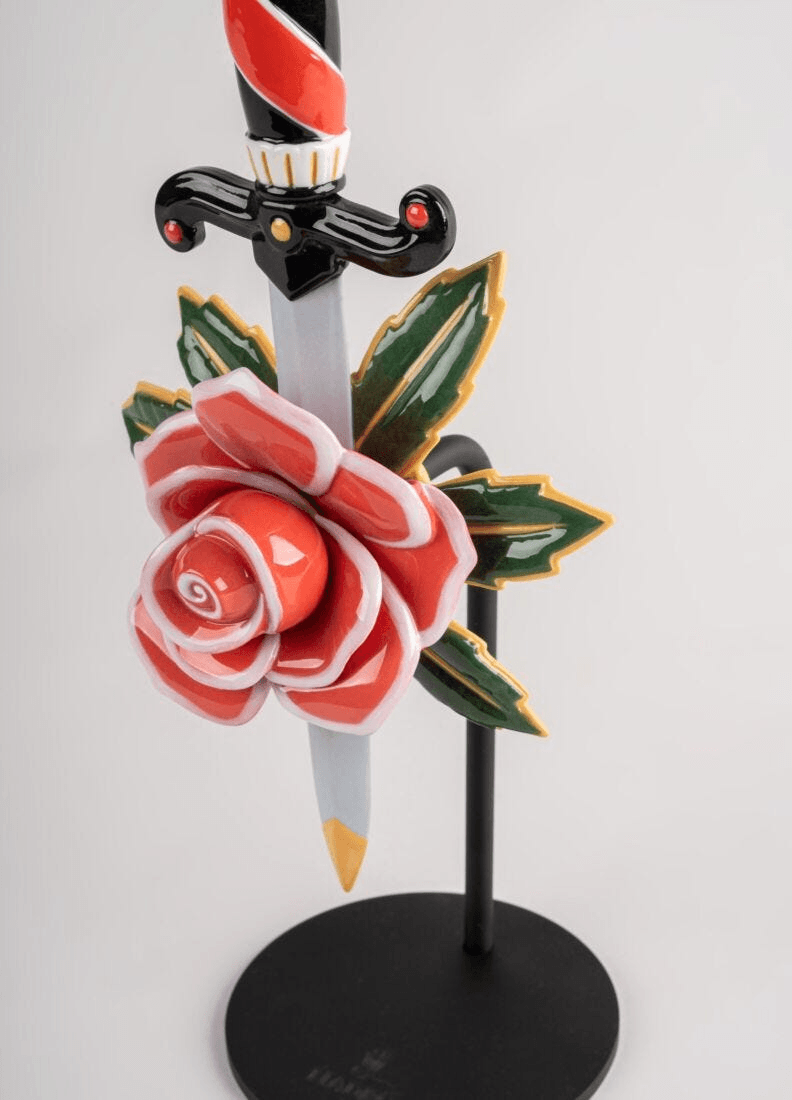 Lladró - Dagger and Rose Figurine showcasing porcelain craftsmanship with a dagger and rose design.