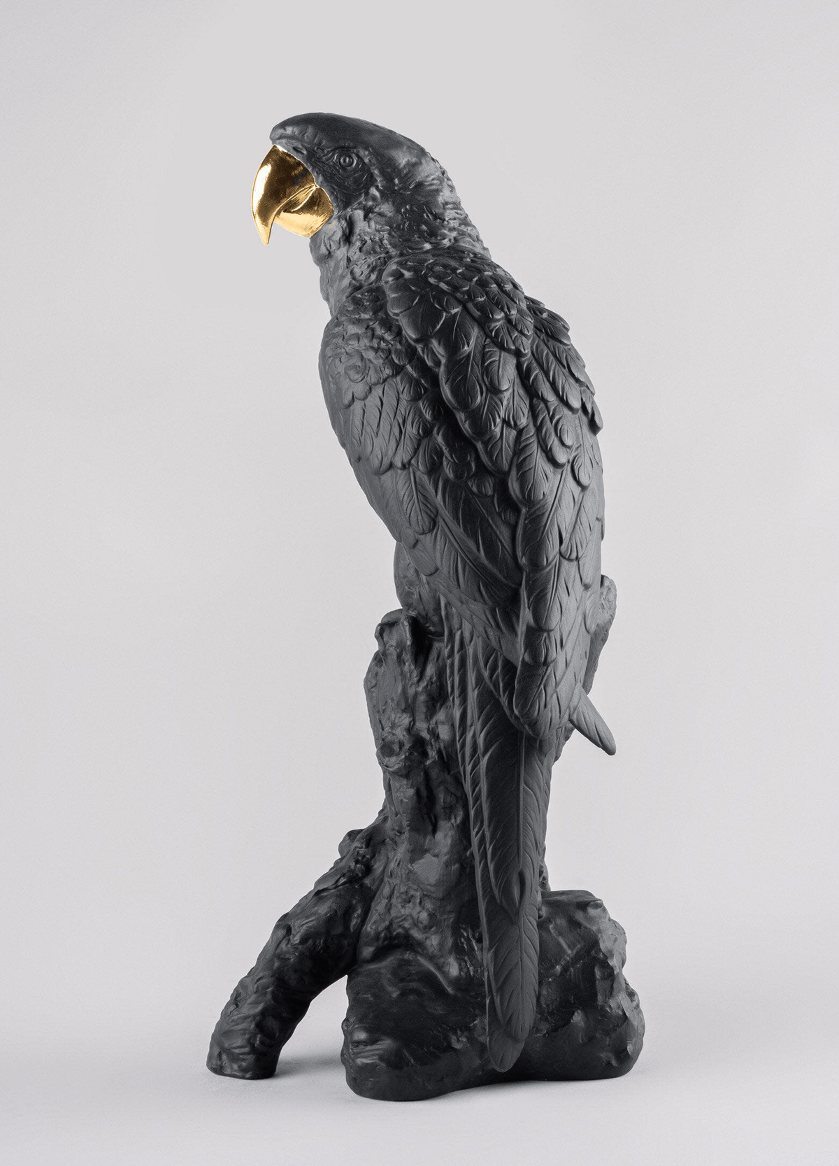 Lladró - Macaw Bird Sculpture - Black-Gold - Limited Edition in porcelain with black and gold tones.