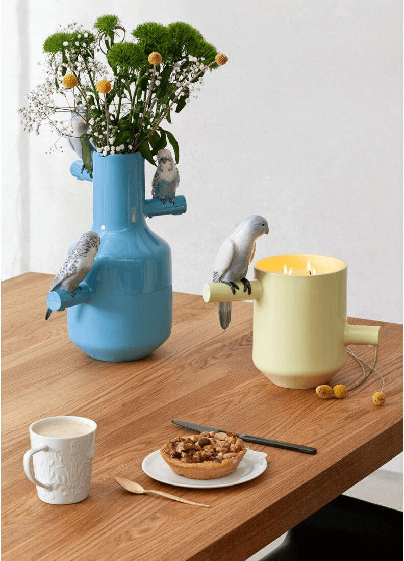 Lladró -Parrot's scented Treasure - On the Prairie Scent - Green vase with birds and flowers on a wooden table.