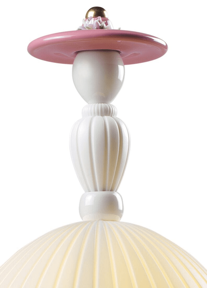 Porcelain Lladro detail of the Lladró - Mademoiselle Table Lamp - Elisabeth featuring white pleats and pink accents.