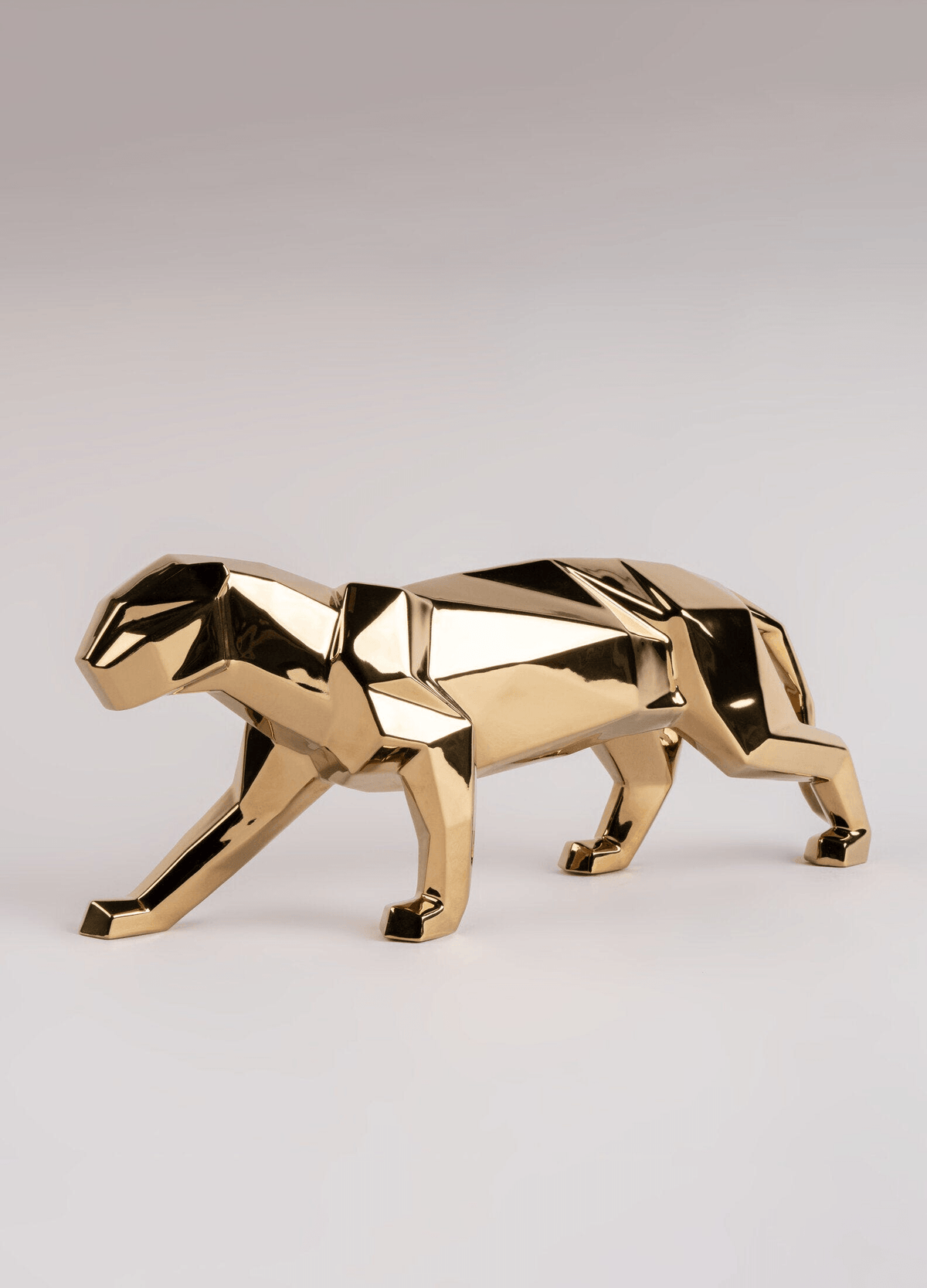 Lladró - Panther Sculpture - Golden in elegant metallic finish, showcasing intricate porcelain origami design.
