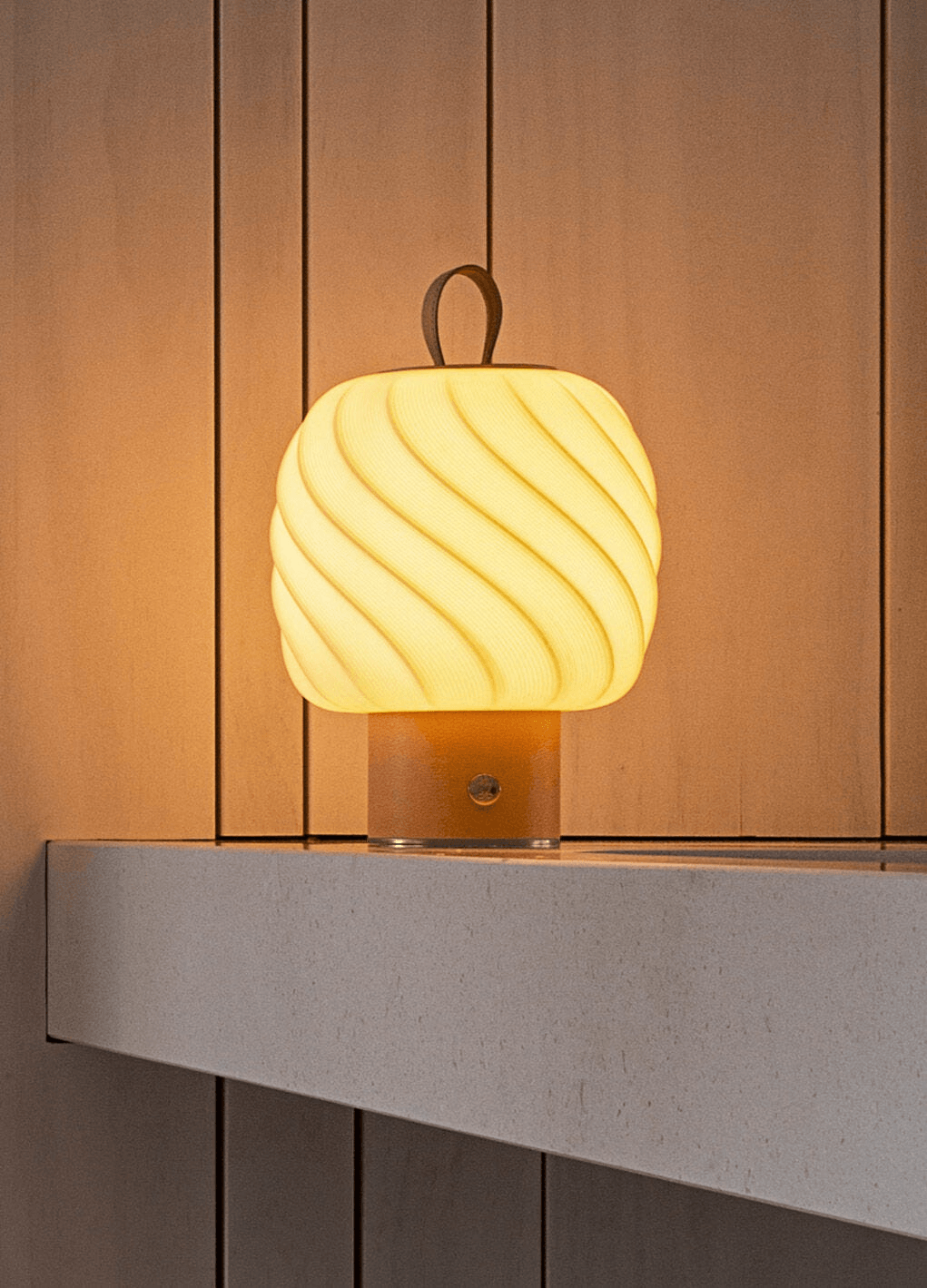 Glowing Lladro Porcelain Lladró - Ice Cream Portable Lamp - Medium - Leather on a counter.