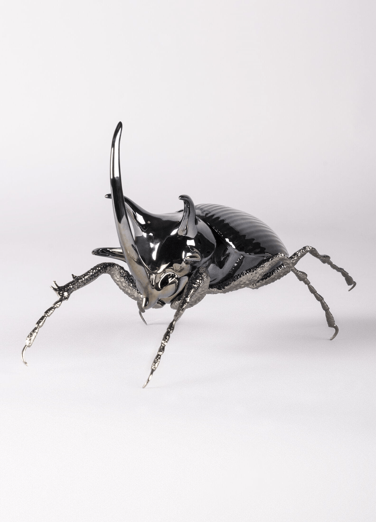 Lladró - Rhinoceros Beetle Figurine made of porcelain with brass legs and graphite finish, ideal for collectors.
