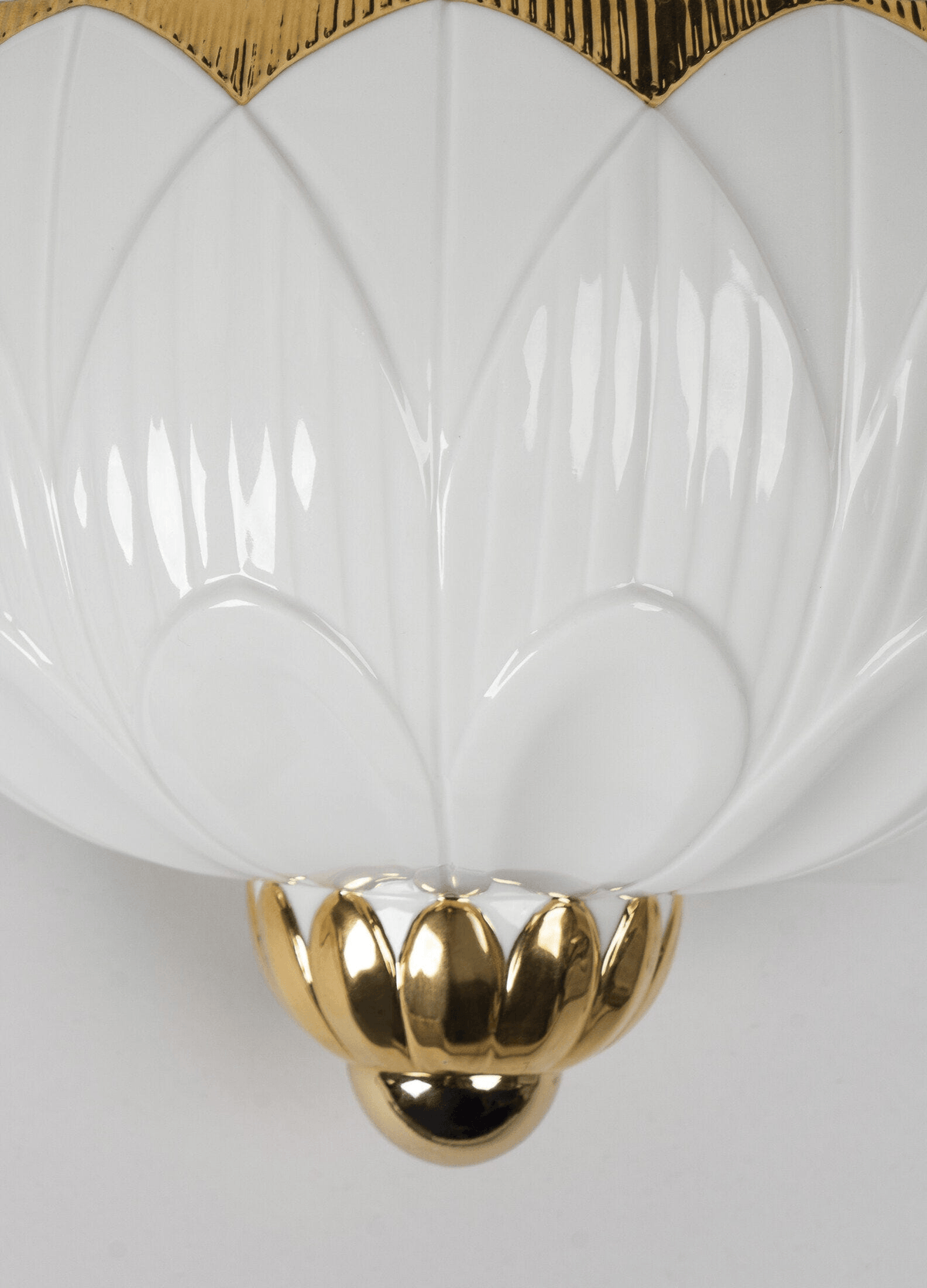 Lladró - Ivy & Seed Wall Sconce close-up view showing porcelain design and gold accents.