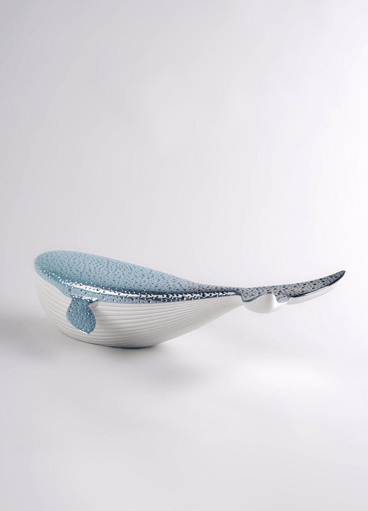 Lladró - Whale porcelain decorative piece with blue and white finish, symbolizing beauty of the sea.