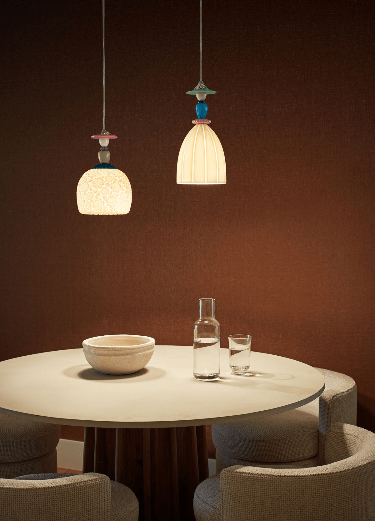 Lladró - Mademoiselle Pendant Light - Daniela hanging above a table with glassware and bowls.