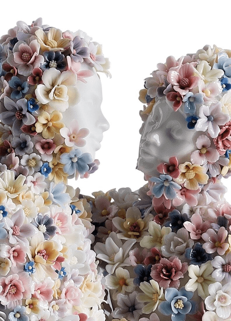 Lladró - Love III (blossoms) Sculpture featuring porcelain blossoms entwined in a romantic embrace.