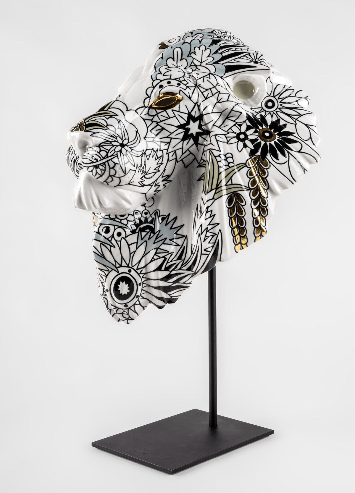 Lladró - Lion Mask - Wild Nature, porcelain mask with floral design and black strokes on a stand.